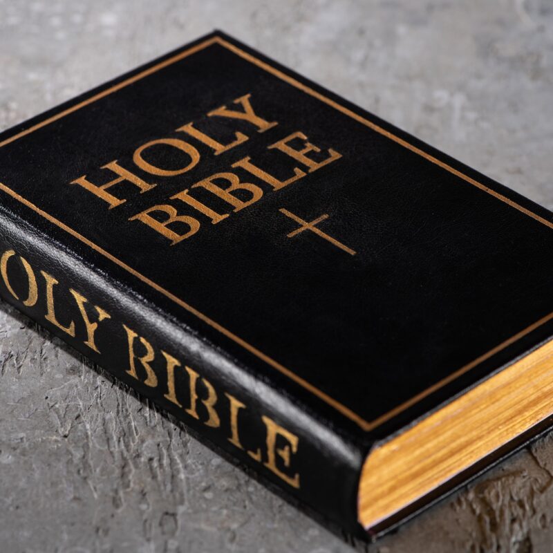 holy bible on grey textured surface